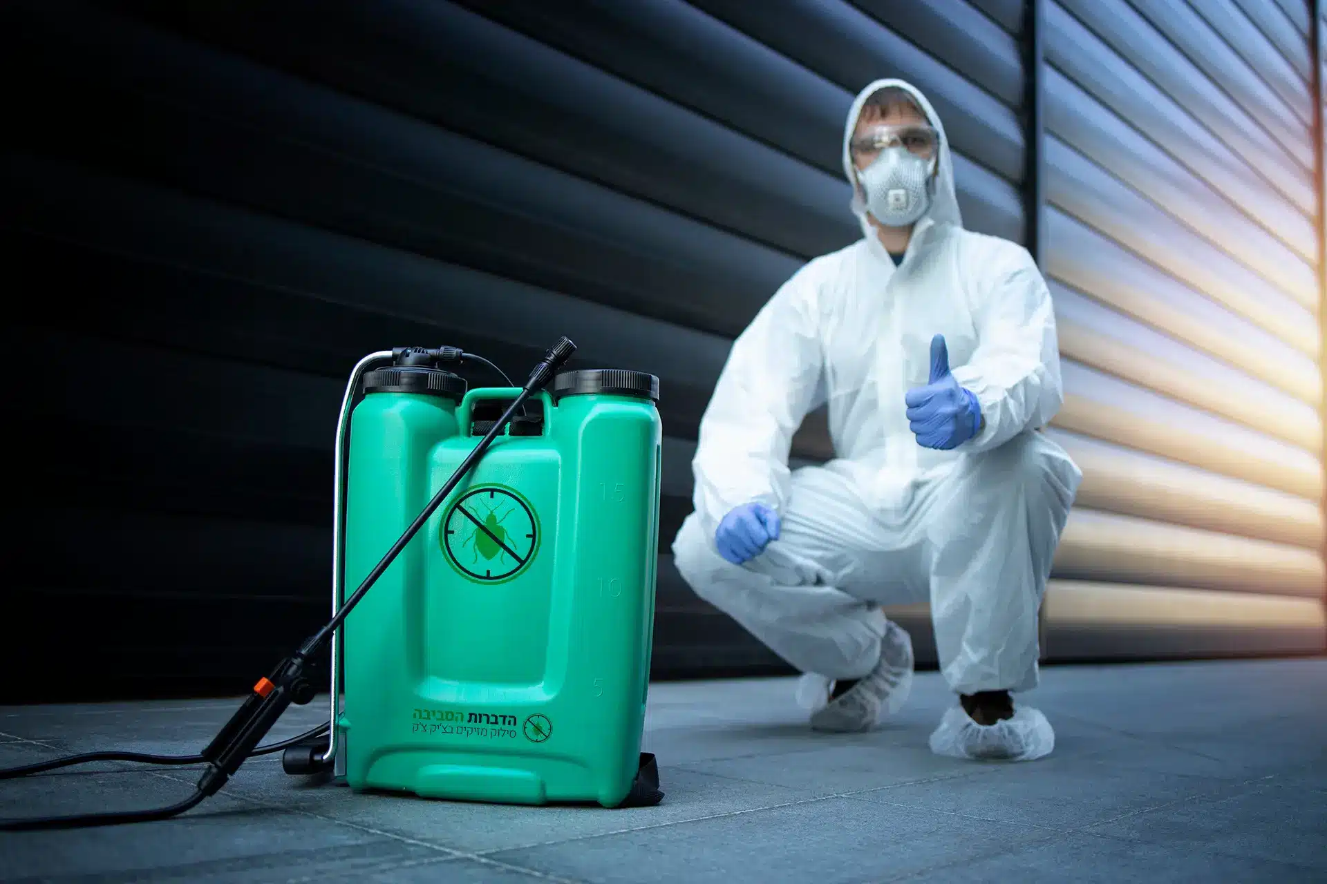 Man spraying pest control solution to address and manage a pest problem.
